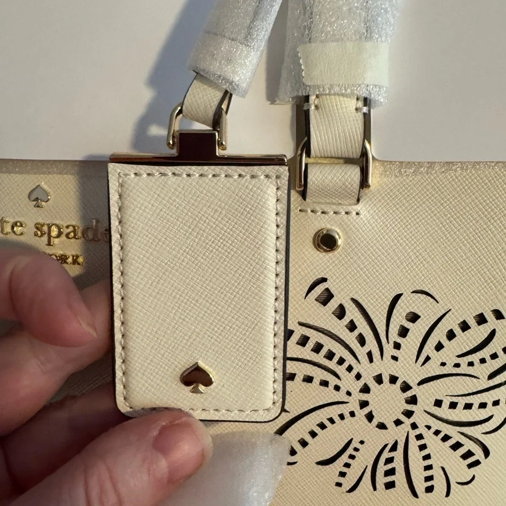 kate spade Cream Tote with Decorative Cutouts and Scarf Accent